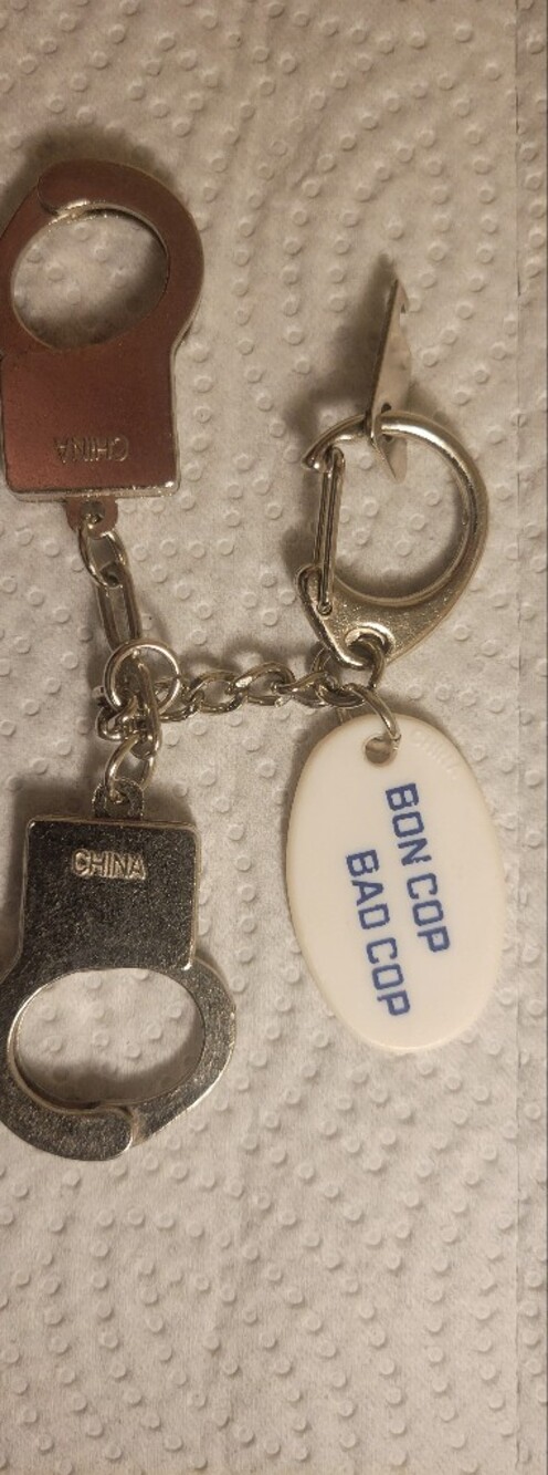 BON COP, BAD COP PROMO Silver Keychain with White 'Bon Cop Bad Cop' Tag